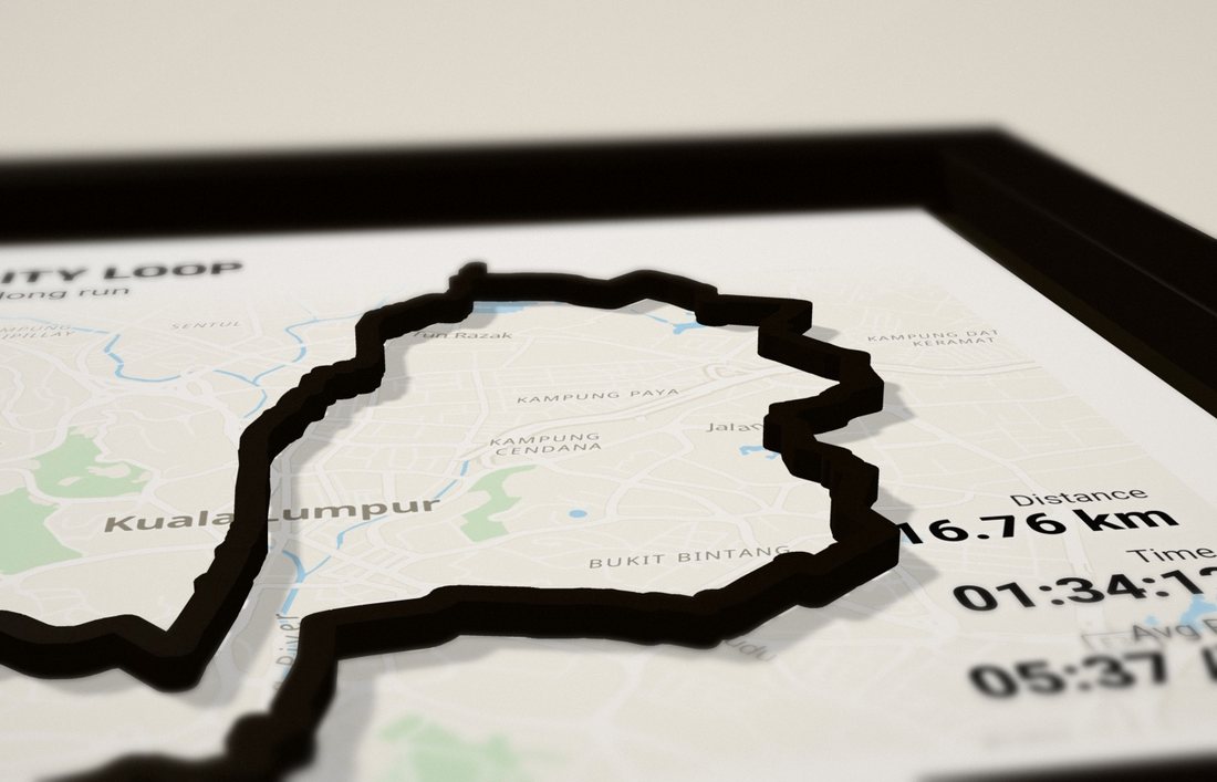 Low-angle view of a black frame showing the route standing off the map and casting a shadow