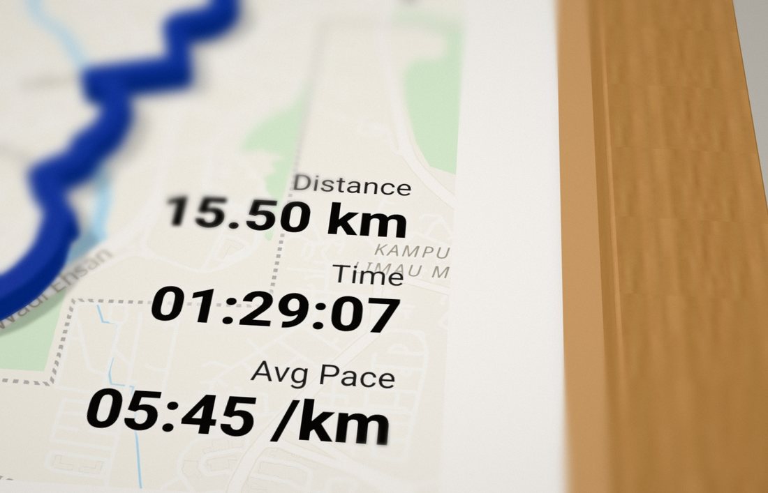 Close-up of the distance, time and average pace printed on the map inside a wood frame