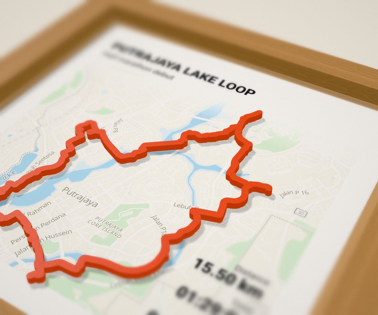 Close-up of a framed map with a race route 3D printed in raised orange