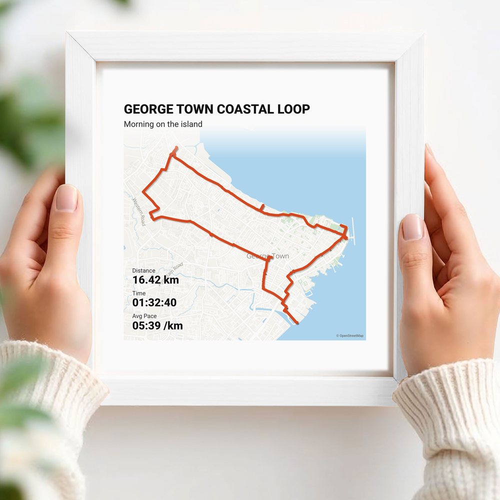 Hands holding a route print in a white frame